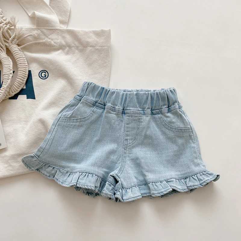 Shorts barns nya sommarbarn och flickor ruffle shorts solida kort denim barn och flickor jeans H240425