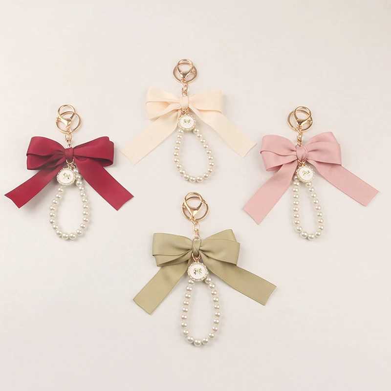 Keychains Lonyards Imitation Pearl Kelechain Sweet Fashion Ribbon Bowknot Accessoires de clés en métal Boucle de boucle