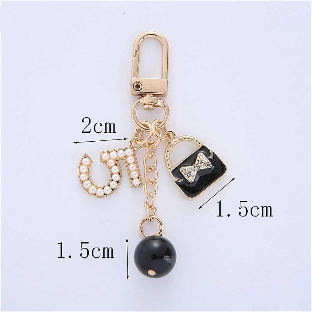 Keychains Lanyards Luxury Handbag Pendant Keychains Fashion Pearl Number 5 Tassel Keyring For Women Bag Ornament Car Key Chains smycken Tillbehör