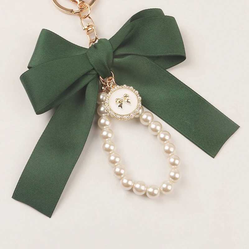 Nyckelringar Lanyards Imitation Pearl Keychain Sweet Fashion Ribbon Bowknot Keyring Accessories Metal Buckle Women Bag Charms Bästa presenter smycken