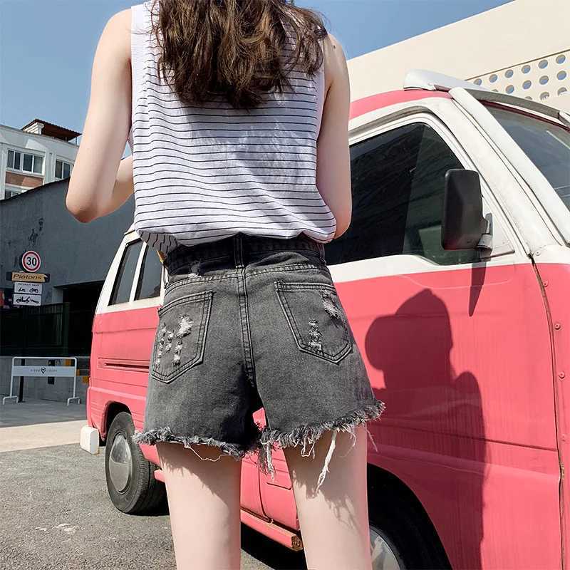 Kvinnors shorts sommar denim shorts för kvinnor koreanska mode tårhål hög midja shorts för kvinnor avslappnade långa ben shorts för kvinnor y240425