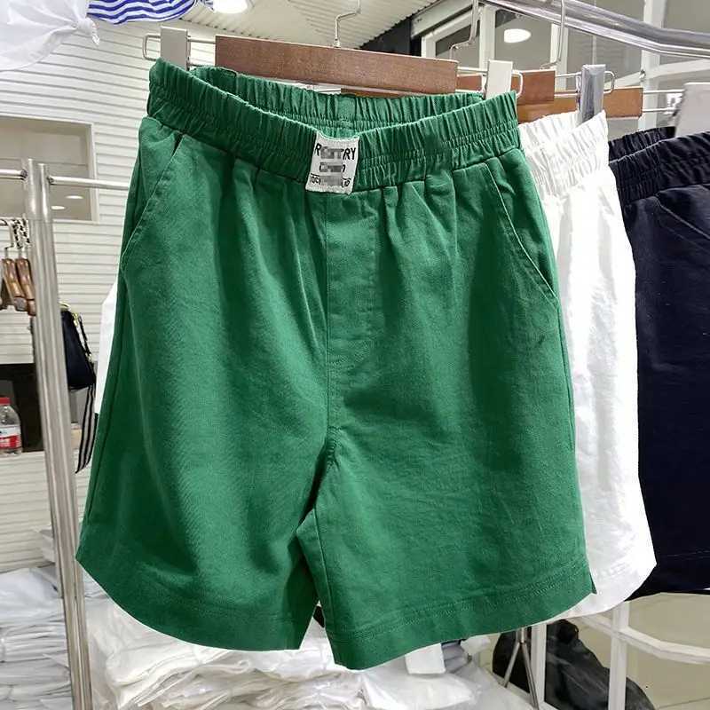 Shorts masculins 2024 Nouveau été de couleur solide mince de couleur élastique élastique haute taille épaulet pantalon large pantalon de jambe lâche consécutive Q240427