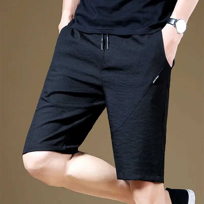 Shorts masculinos de camisa de bolso de cintura elástica e elástica da moda para homens 2023 Verão novo cor sólido de cor sólida coreana q240427
