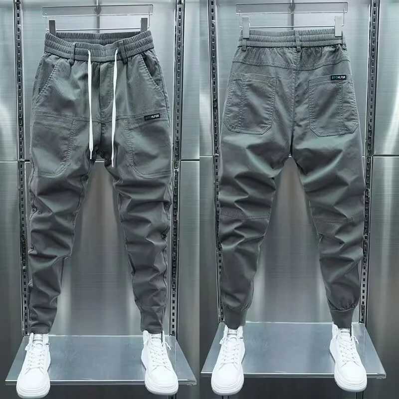 Pantaloni da uomo 2023 pantaloni da uomo primavera/estate giapponese abbigliamento da strade da jogging pantaloni da uomo abbigliamento casual elastico pantaloni sportivi in vita elastico 2404