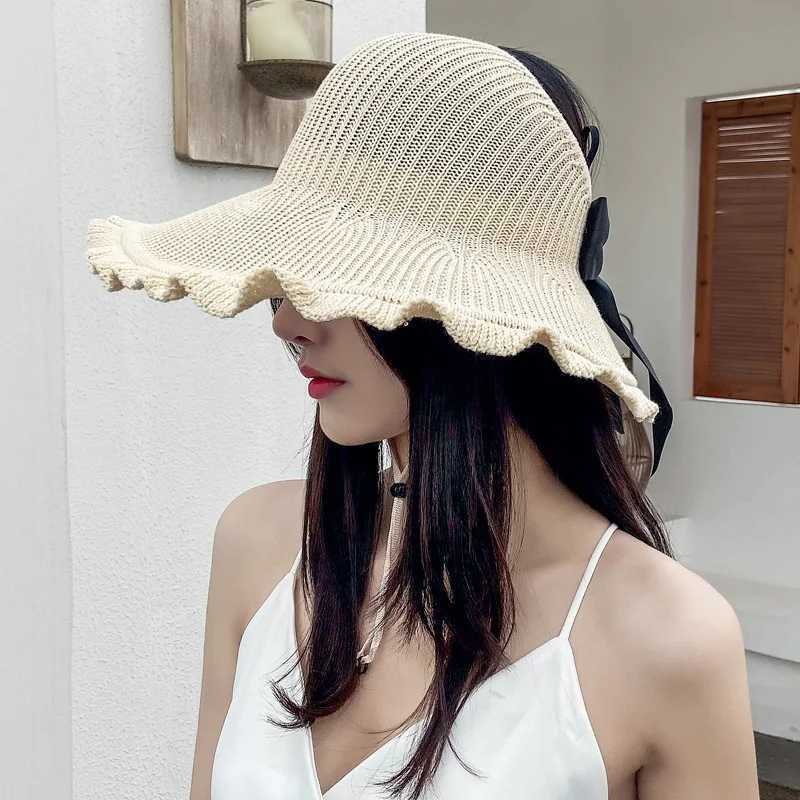 Bélleurs de chapeaux à bord large 2024 Nouveaux femmes Roll Up Sun Umbrella Hat de paille d'été pliable Emballage UV Protecteur adapté à la plage de la plage Q240427