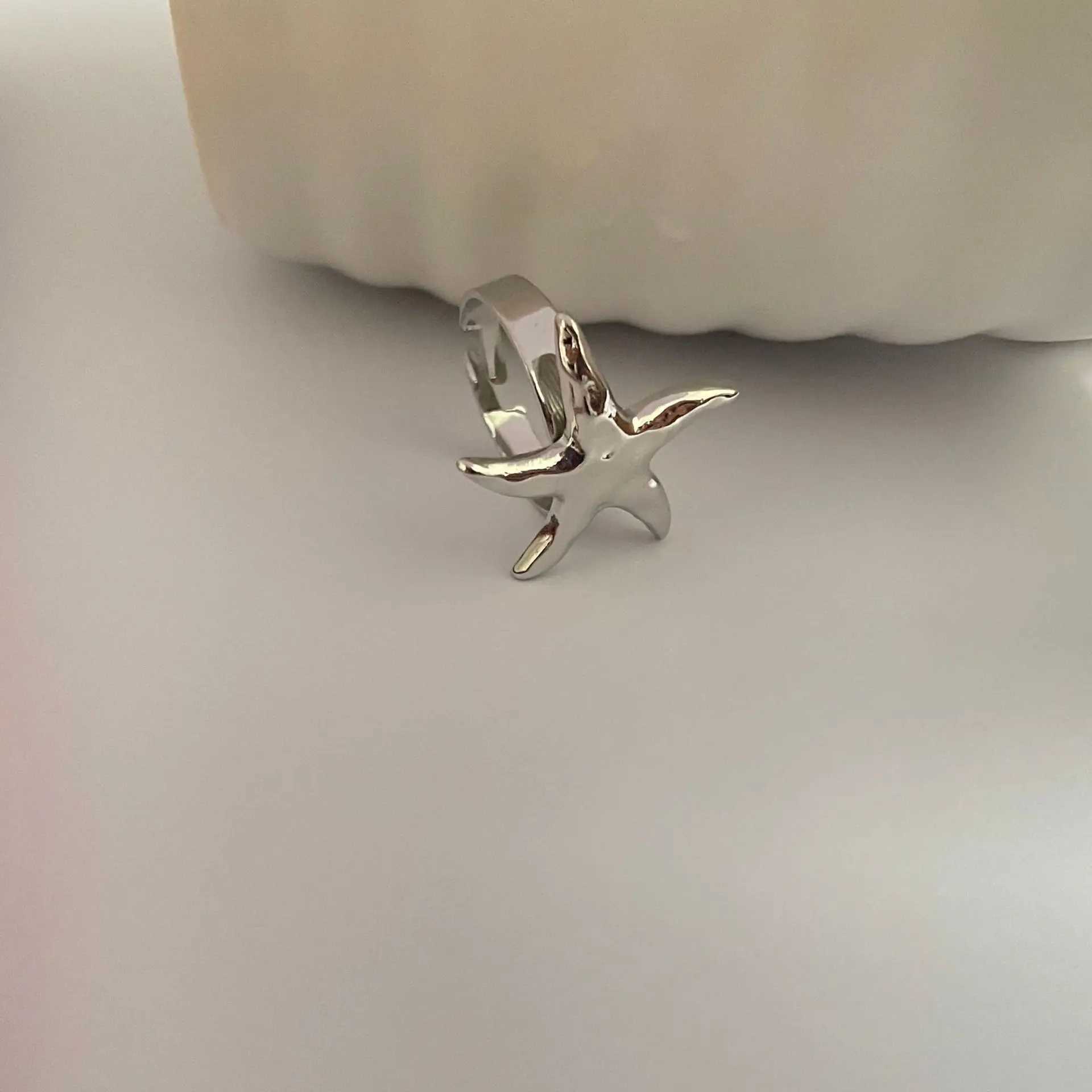 Trouwringen Personaliseerde zeester openen metalen ring met een minimalistisch en modieus niche -ontwerp Verstelbare hand sieradentrend