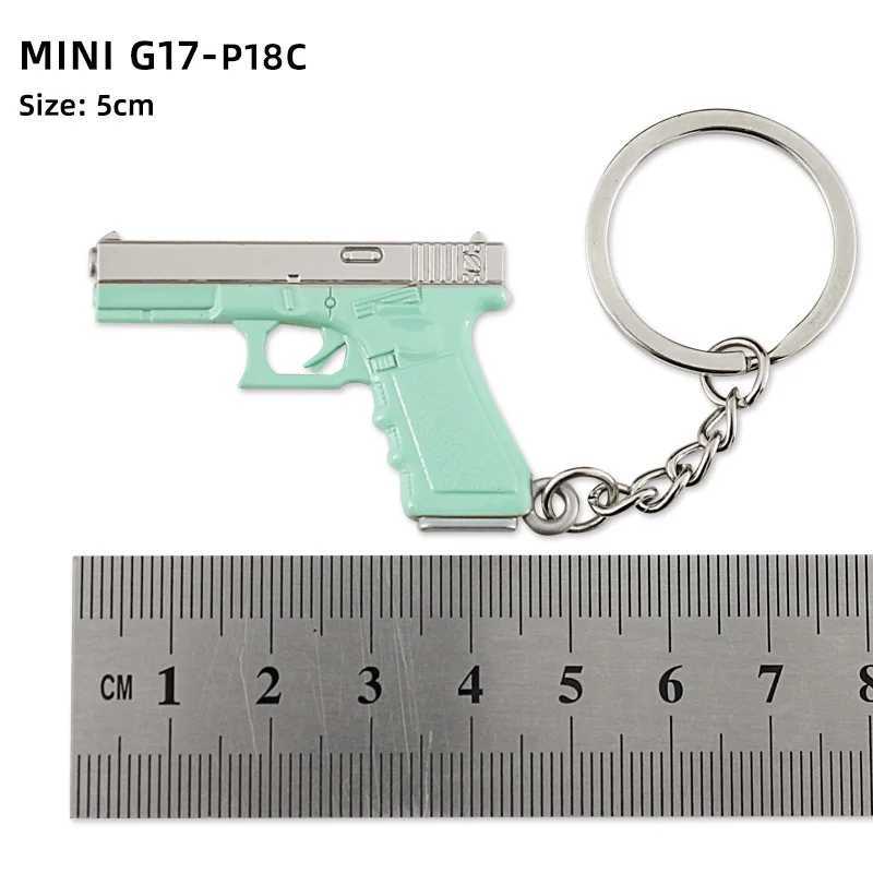 Toyadores de pistola Tot Gun Keychain G17 P18C Mini All Metal Model Juego circundante Luces de llavero Pistola Juguete Birthday T240428