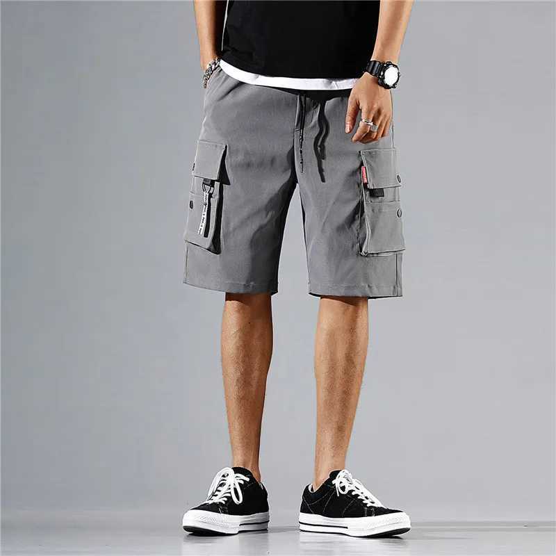 Mäns shorts Mens Cargo Pants Knee Shorts Classic Summer med flera fickor Stor bomull Halva Khaki Gray Q240427