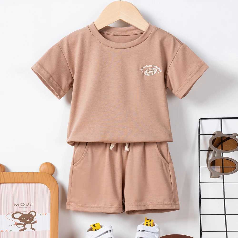 Vêtements Sets New Summer Ldren Sets Boys Girls Girls Short Sleeve Rugby / Daisy broderie T-shirt + Shorts solides Set Kids Leisure Suits H240429