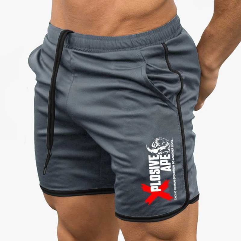 Shorts masculins Été Nouvelle tendance décontractée cordon de crampons pour hommes shorts sportifs minces mince séchage rapide et décontracté ruisseonnette à cinq quarts pantalons J240429