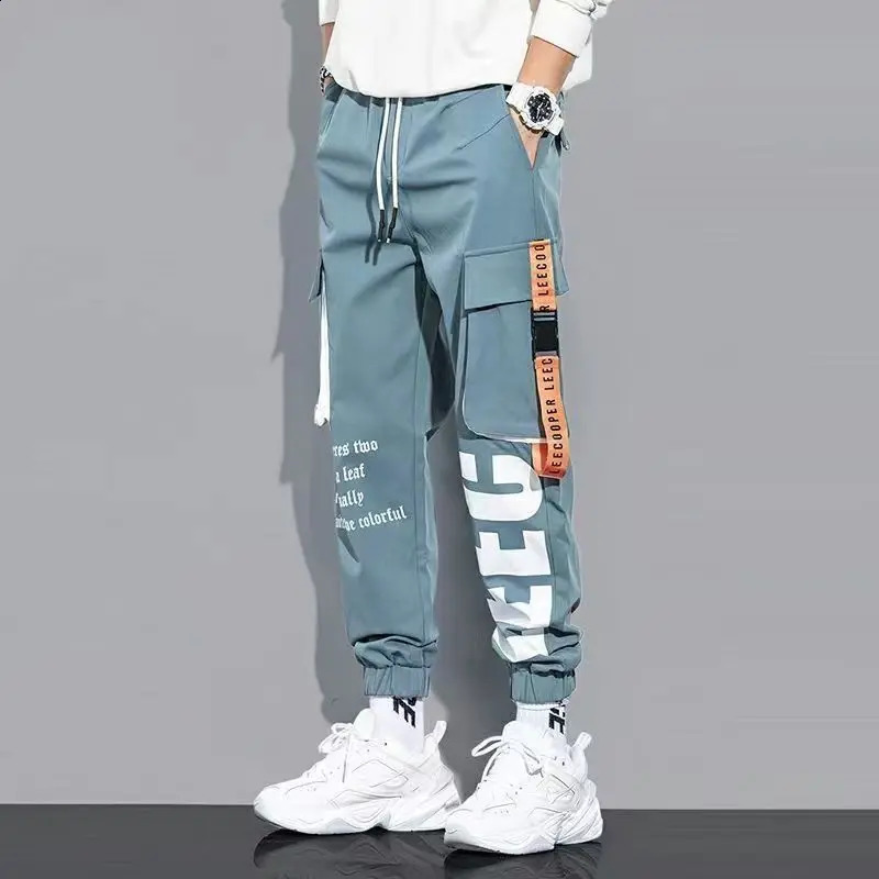 Klasyczne streetwearne spodni Mężczyźni Wstążki haremowe spodnie do joggingu męskie Slim Fit Spring Cargo Spodnie Multi-Pockets Women Spodni J7 240124