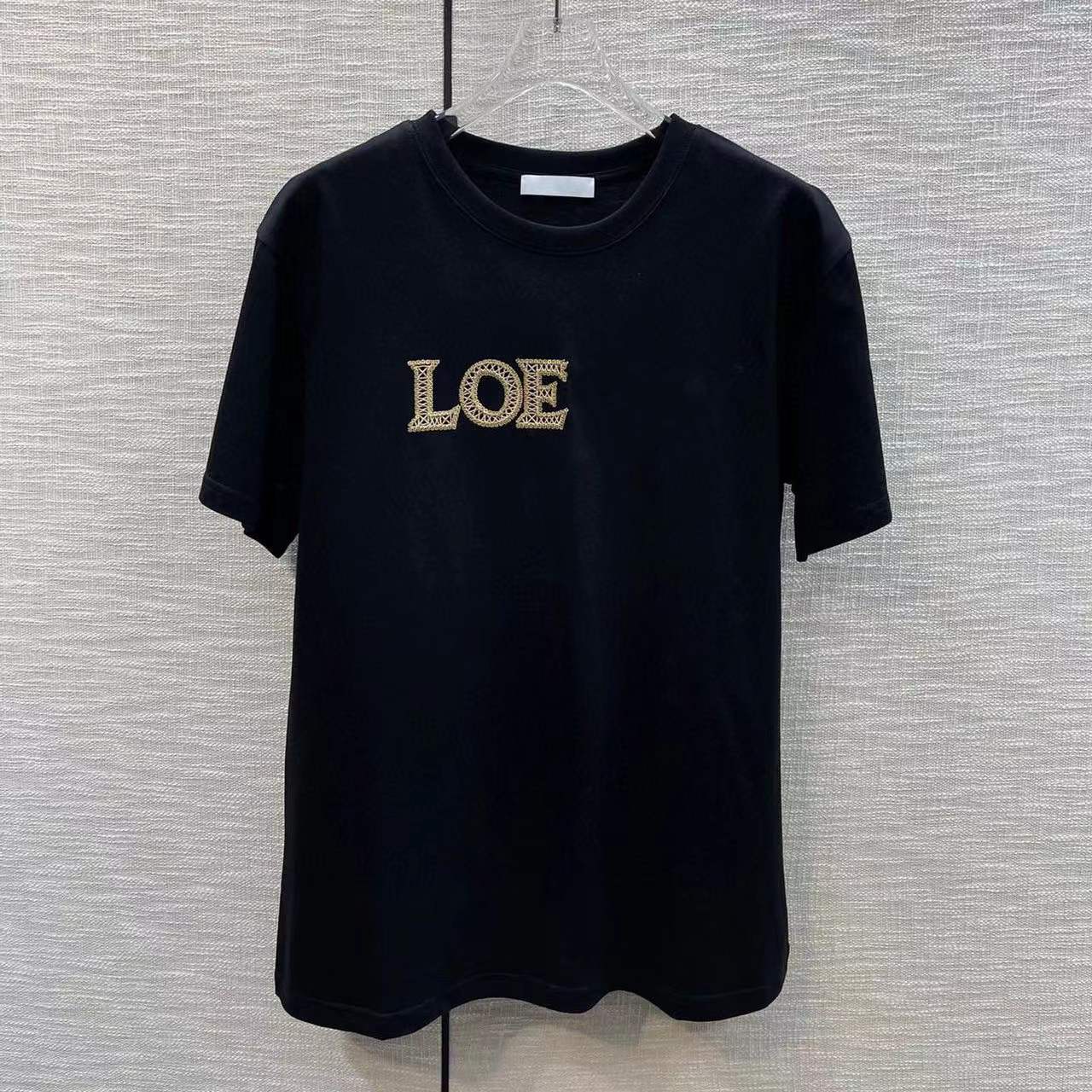 T-shirt de créateur à la mode pour femmes, lettre brodée, manches courtes, blanc, noir, col rond, style à la mode, printemps 2024, nouveau