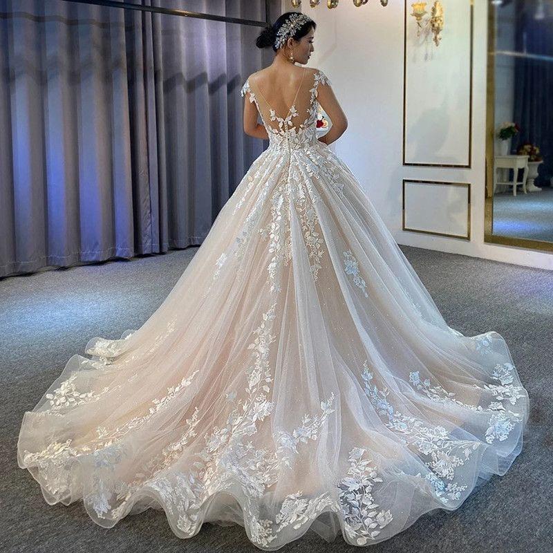 Gorgeous Lace Appliqued Ball Gown Wedding Dresses With Cap Sleeves Sheer Neck Vestidos De Novia Plus Size Sweep Train Sexy Open Back Bridal Reception Gowns CL1030