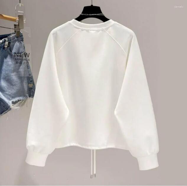 Designficka pullovers vita kvinnor korta nederkant tops långärmare vårens hösttrend tröjor för lösning lös tröja