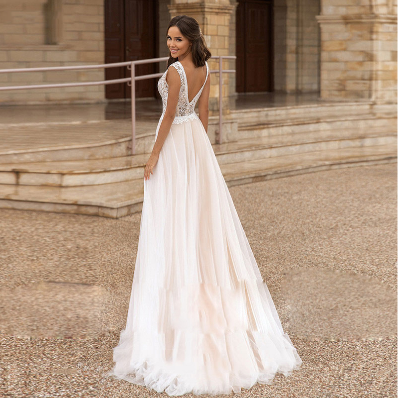 Abiti da sposa senza maniche in pizzo con scollo a V Abito da sposa semplice ed elegante con corpetto illusione la sposa Abito da sposa sexy da spiaggia con schiena aperta