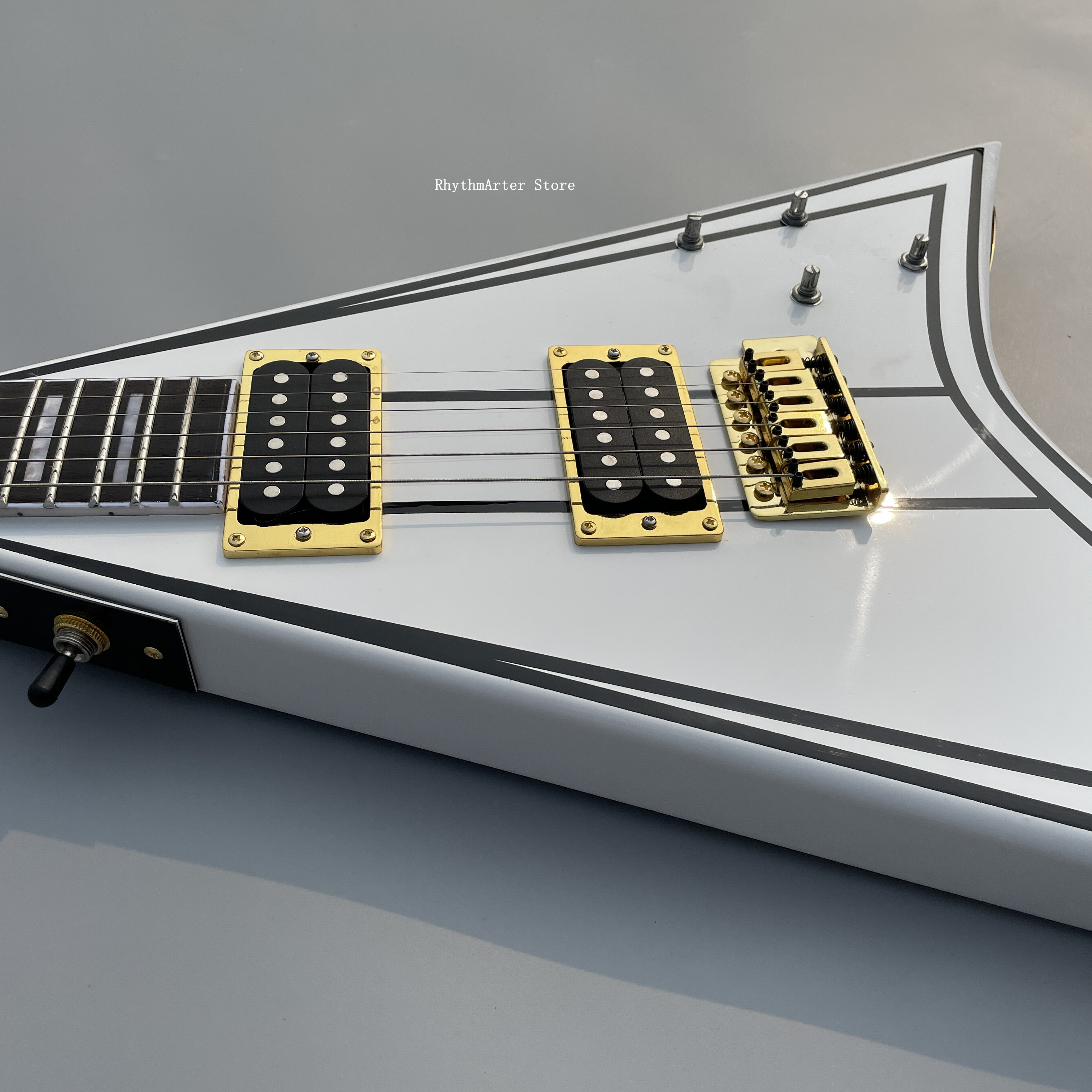 Custom shaped electric guitar, white V asymmetric body with black pattern, ebony fingerboard, gold color hardware, 