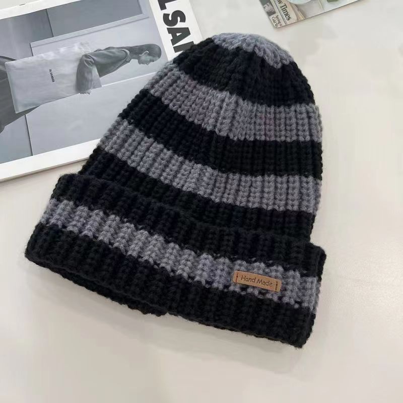 Korean version of the autumn and winter knitted hat stripes warm heart fashion with a small minority princess small fragrance and foreign air bag ear warm explosion