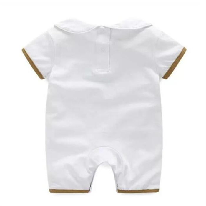 Designer Baby Romper Bomull Baby Pojkar Flickkläder Tecknad Kortärmad dockkrage Nyfödd Jumpsuits Hatt Haklapp Outfit Klädset