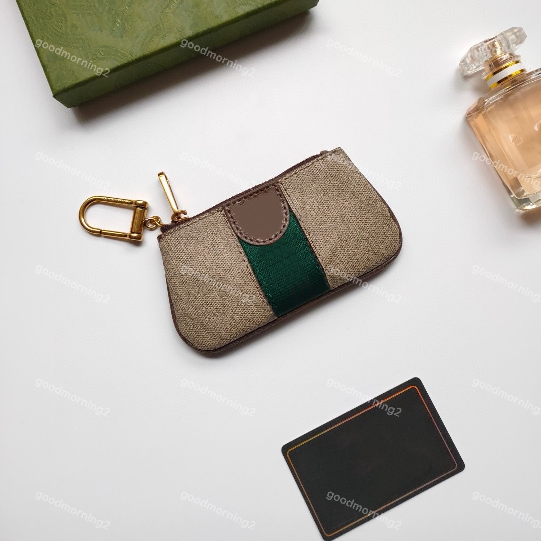 Män kvinnor nyckel plånböcker designer mode mynt handväska kort hållare hänge plånbok äkta läder blixtlås väska accessoires 2939