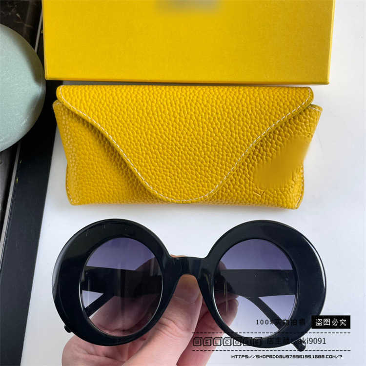 2024 New High Quality luxury designer New Luo Yijia sunglasses round frame mesh red INS the same style personalized and fashionable Sunglasses LW40089