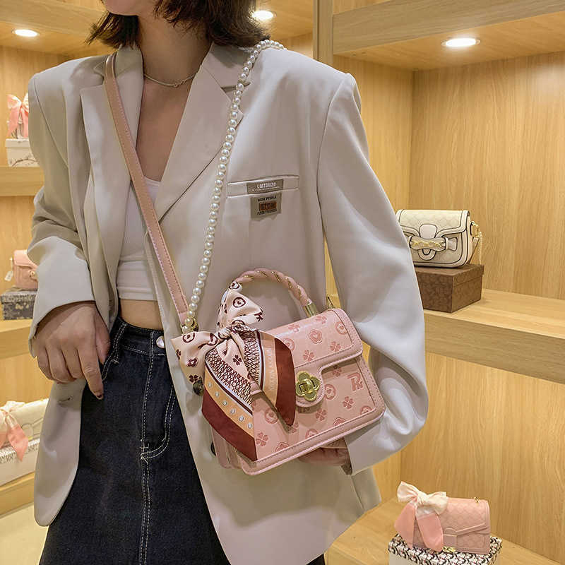 2024 New luxury high quality handbag Factory direct sales Spring Live Broadcast Good Style and end Embossed Pink Small Square Handheld One Crossbody Women's