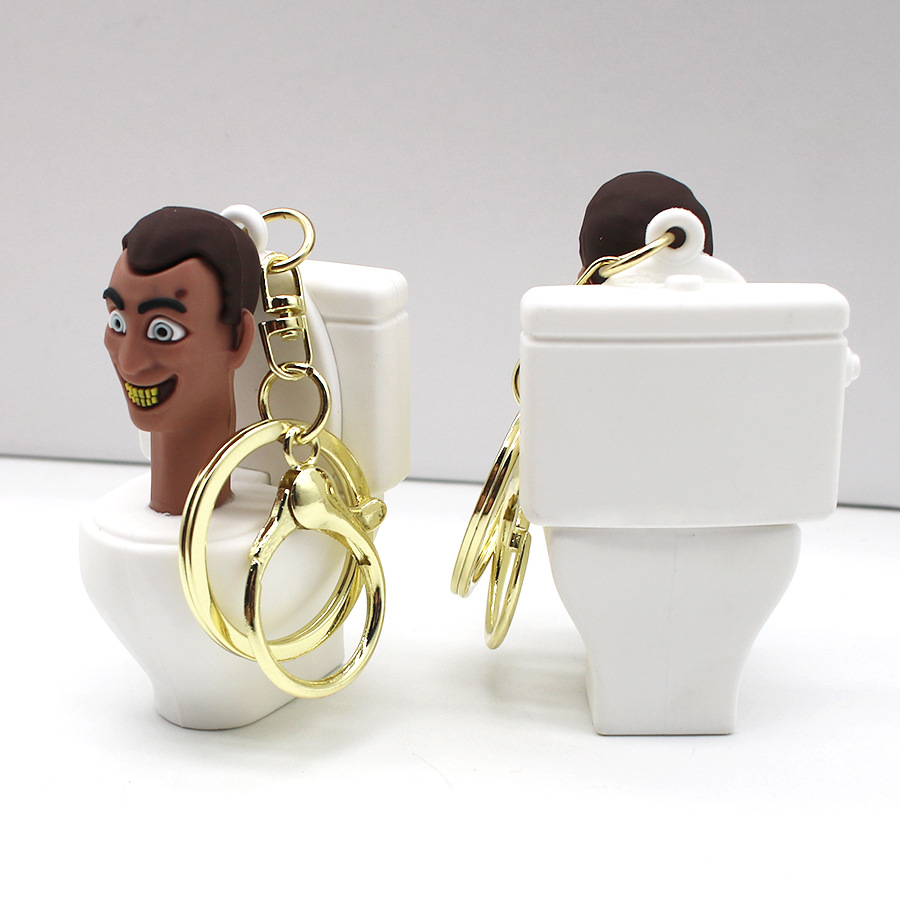 Skifidi المرحاض رجل الكاميرا Drip Glue Toy Keychain Game Pendant Pendant