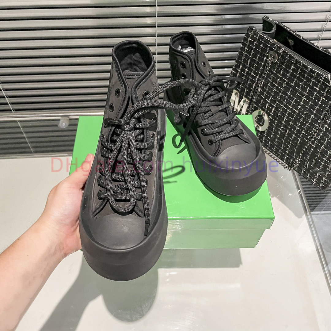 Designer skor vulcan sneakers kvinnor män mode casual skor kalvskinn läder vårens hösten duk med hög topp snörning sneakers utomhus svartvita par tränare