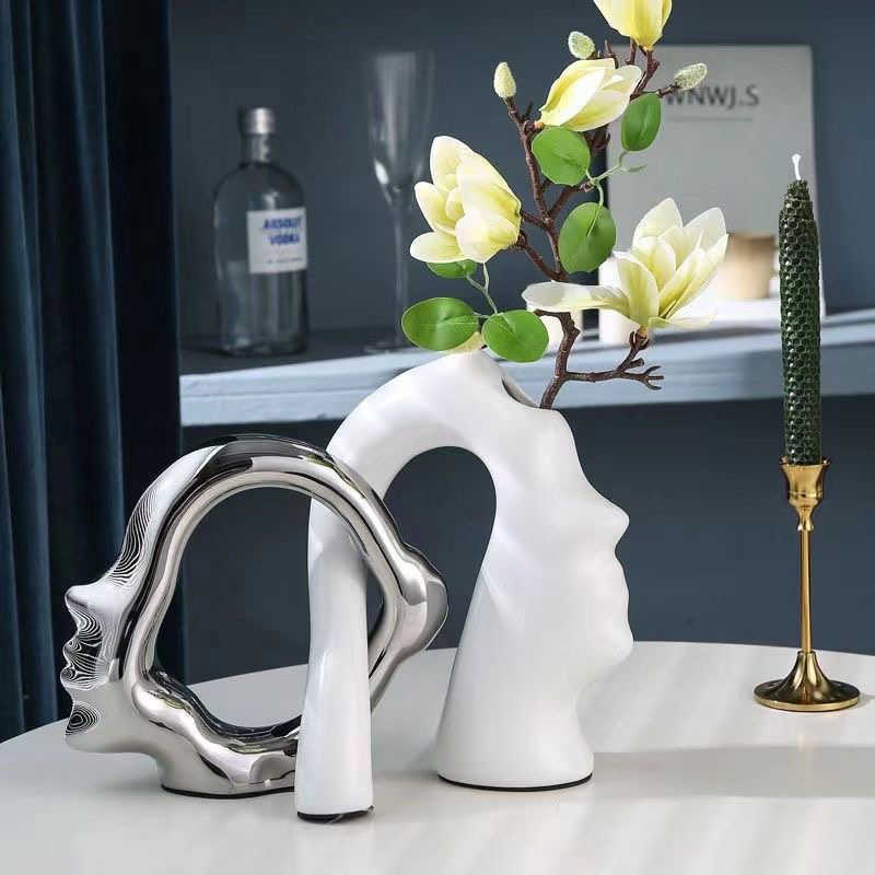 Kreatywne nowoczesne proste ceramiczne wazon sztuka twarz światło luksusowe srebrne ozdoby domowe mecze ręczne