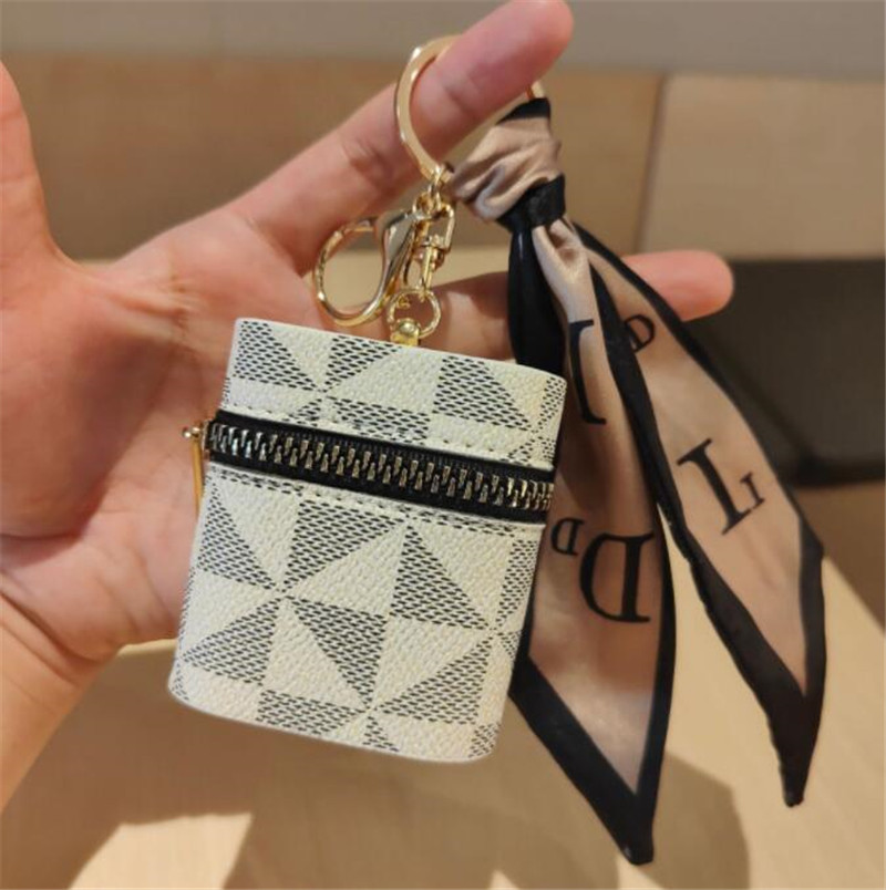 Créativité Presbyopie Car Keychain Coin Purse Pendante Charme Bijoux de trappe PU PU Cuir Flower Grid Designer Metal Key Chain Multicolor