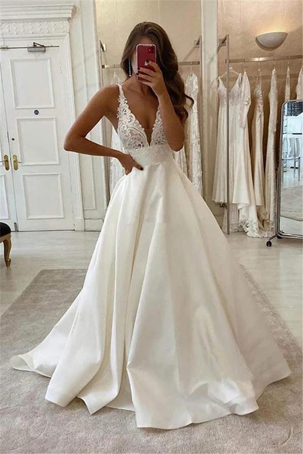 2023 Vintage A Line Wedding Dresses With Buttons Sexig öppen rygg Vestidos de Novia v Neck Satin Lace Applicques Sleeveless Bride Wedding Downs Plus Size