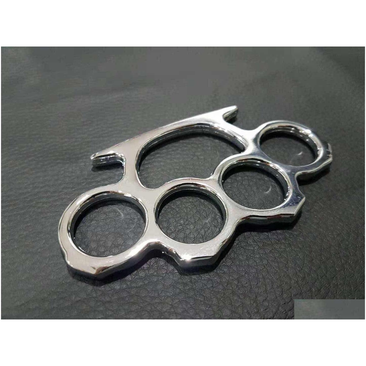 weight about 86g silverblackgold color thin steel brass knuckle dustersself