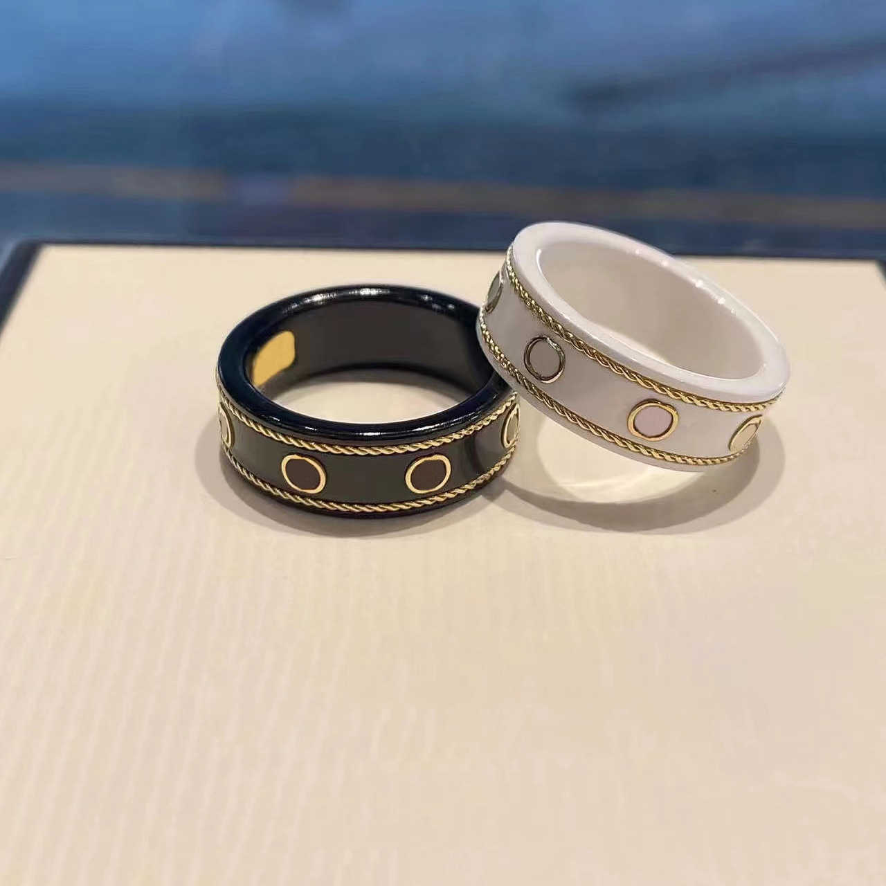 Top designer jewelry black white ceramic ancient family 18K rose gold planet strange men and women's same style couple ring