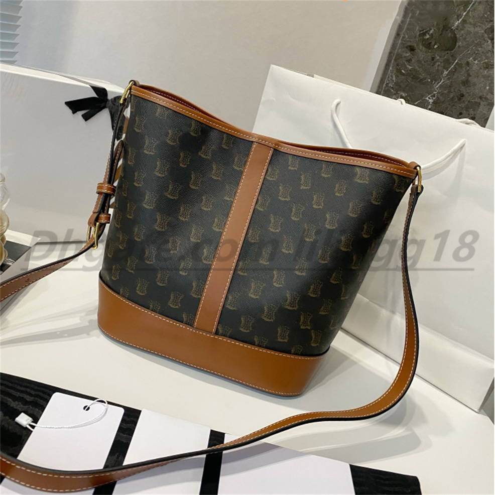 Bolsos de diseñador de alta calidad Bolso de cuero real Logotipo de los hombres de las mujeres Bolso de cubo Bolso de lujo Diseñador Canal de moda Patrón simple Bolsos de hombro de moda monedero