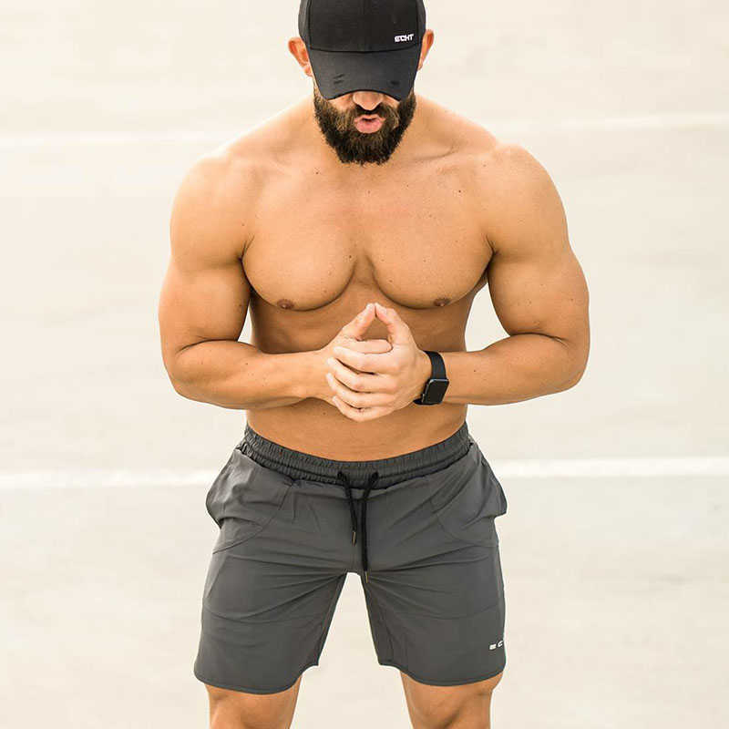 Shorts pour hommes GYMOHYEAH Nouveau 2019 Été Hommes Fitness Bodybuilding Respirant Séchage Rapide Court Gymnases Hommes Casual Joggers Shorts M-2xl En Gros W0327