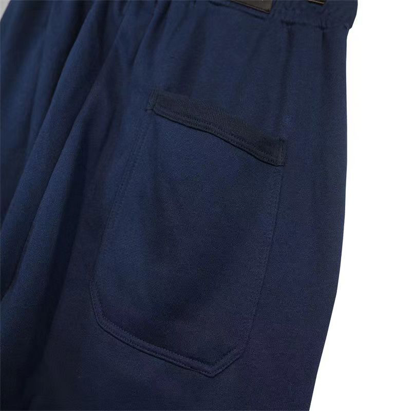 Pontas de designer de verão de primavera masculino Pant esportivo de impressão de cordas elásticas de cordão lixo Casal casal de algodão azul de algodão versátil calças casuais