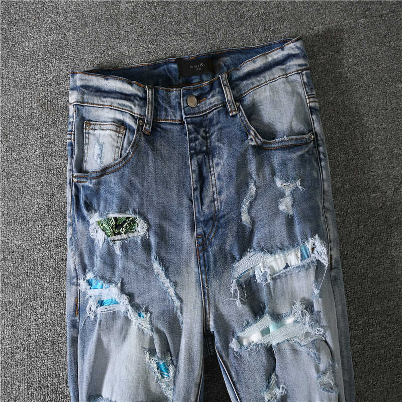 Jeans Jeans Jeans Jean Amirres jeans calças de jeans do novo patch de cor de rua fez o velho buraco arco -íris de moda danificado 98lz