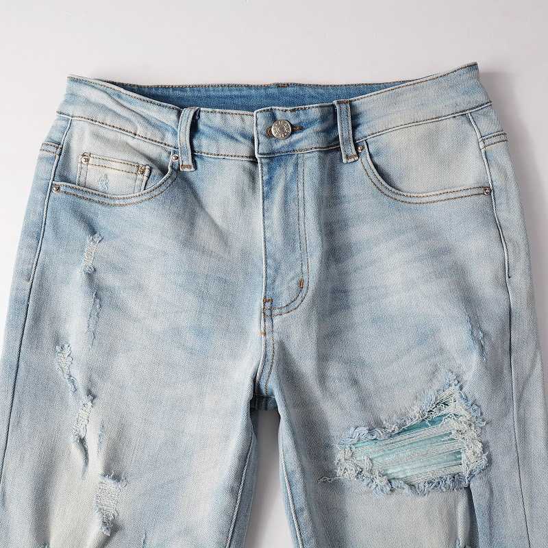 Jeans de designer Jean Amirres Denim Hommes Pantalons TrendHigh Street Light Blue Jeans Perforés Patch Slim Fit Élastique Pieds Serrés YQ5P