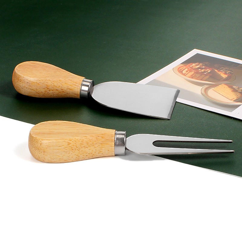 Mango de madera Juego de cuchillos de queso de acero inoxidable Cortador de crema Mantequilla Espátula Queso Juego de cuchillos de queso Juego de cubiertos LX5594
