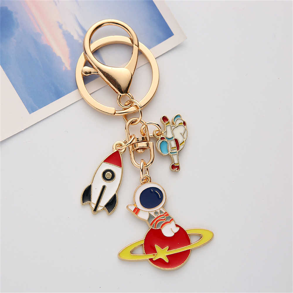 New Creative Astronaut Keychain Enameled Metal Rocket Star Keyring Planet Pendant for Students Bag Ornament Key Accessory Party Gift