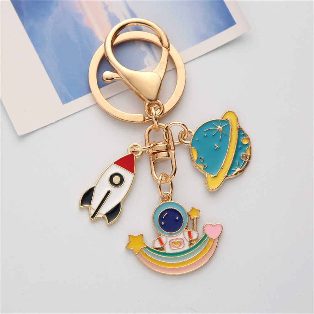 New Creative Astronaut Keychain Enameled Metal Rocket Star Keyring Planet Pendant for Students Bag Ornament Key Accessory Party Gift