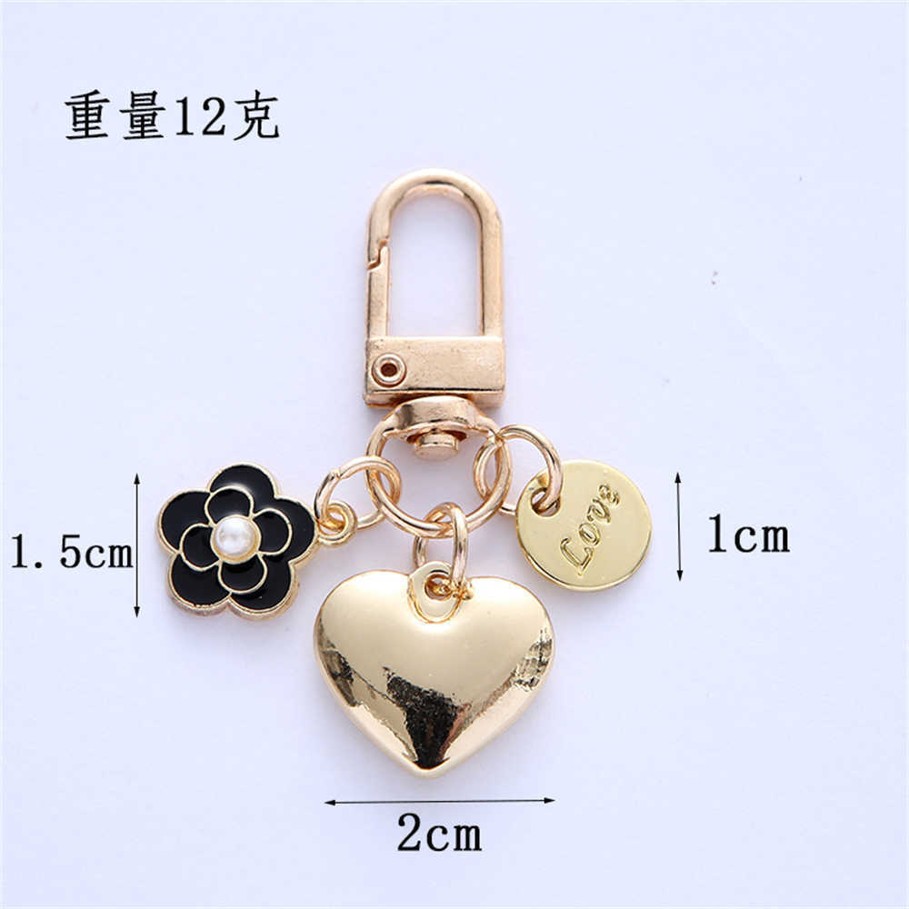 Nouveau nouveau porte-clés coeur en métal mode lettres camélia pendentif rond pour femmes filles étui pour casque accessoire sac bibelot cadeau de fête