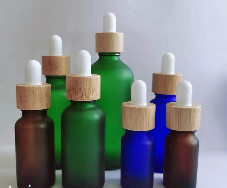 Frostat glas eteriska oljedropparflaskor blå bärnsten grön serumflaska med bambu cap 10 ml 20 ml 30 ml 50 ml 100 ml SN794