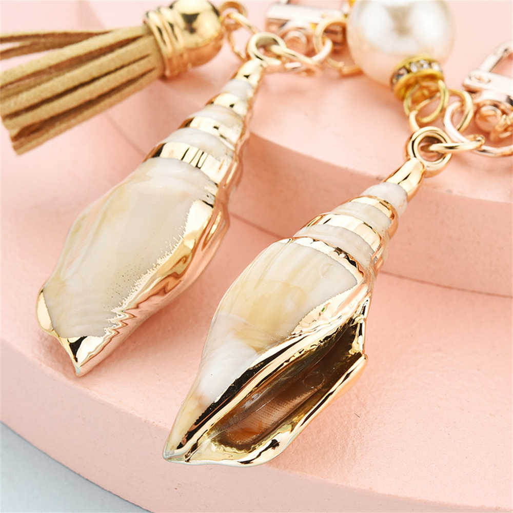 Keychains Nieuwe exit Conch Keychain Pearl Shell Tassel Keyring Charmante dameszak Decoratie mode Keyholder accessoires G230526