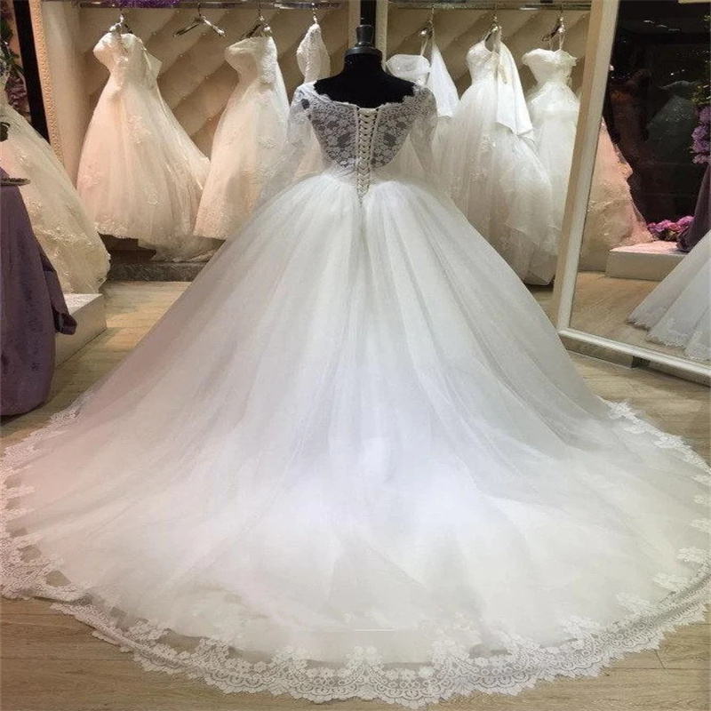 Princess Laceful Wedding Dress Illusion Långärmad bollklänning Landsstil Brudklänningsapplikationer Korsett Sweep Train Tulle Bride Dress Farm Robe de Mariage 2024