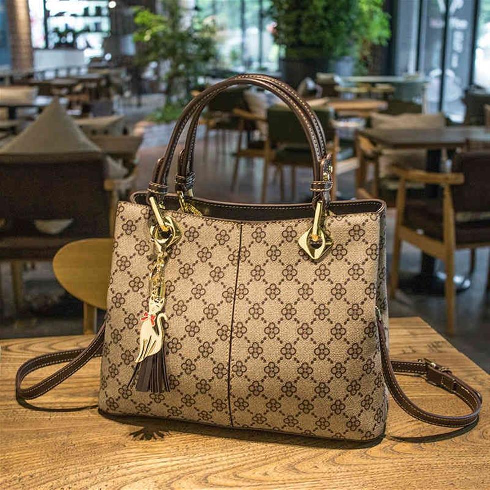 Frauenbeutel Sommer Neue Frauenhandtasche mittleren Alters der Mutter im mittleren Alter der Mutter mit einem Schulter-Messenger-Tasche Geldbörsen Y7CR351y