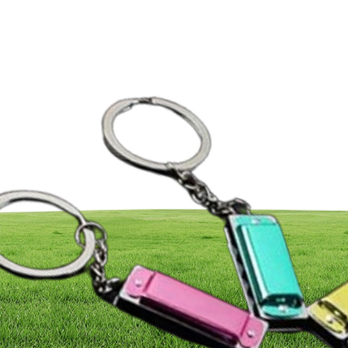 100 шт./Лот Метал 4 отверстия Mini Harmonica Keychain Toy's Keyring Kid's Gist's Gifts Ceal Chain Bags Mobile Key Rings3407130