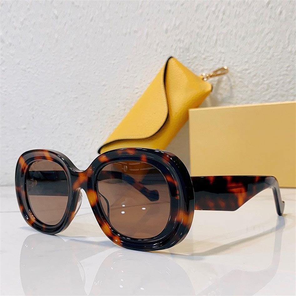 Ny explosiv trend solglasögon Mens Ladies Luxury Designer Shades Model40103 Outdoor Driving Anti-UV Miss Sunglasses Round Top Qu260e
