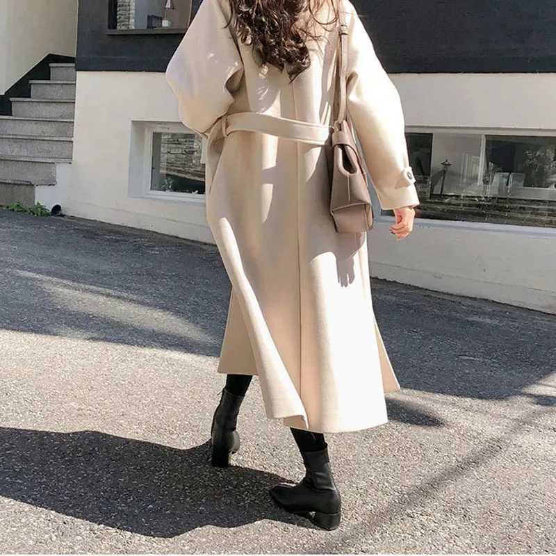 女性のウールブレンド冬の韓国の女性フェイクウールコートファッションエレガントなソリッドベルト長いジャケットの肥厚女性ルーズオールマッチブレンドアウトウェアJ231227