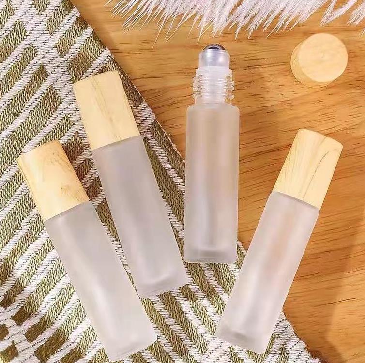 10 ml Amber Blue Clear Frosted Glass Roll On Bottle Essential Oil Parfym Bottle Travel Dispenser Bottle Steel Roller Ball Wood Grain Cap SN6314