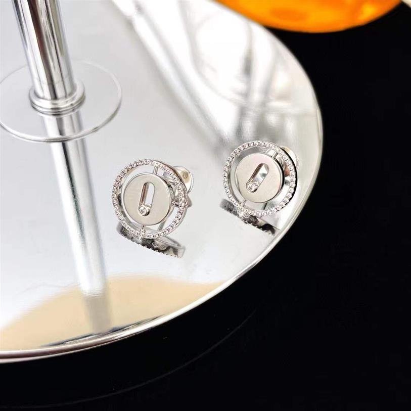 2023 Nouveau luxe S925 Bijoux en argent sterling Lucky Move Stud Boucle d'oreille ronde Coin Design Trendy Slide Moving CZ Zircon cubique Pierre E220j